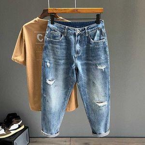 Heren jeans hiphop jeans heren gerafeld ultradunne kleine voetstraat kleding blauwe enkel lengte denim broek Retro retro gesneden broek Q240427