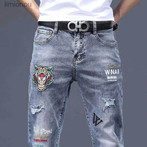 Jeans masculin Vente chaude de luxe de luxe masculin streetwear pantalon denim punk trou en détresse Tiger broderie Patches étirées Skinny Ripped Trousserl240119