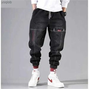 Jeans masculin coréenne de la mode de mode de la cheville jeans jeans noirs gris cargo masque élastique poche harem pantalon street vêtements hip-hop jeansl2404l2403