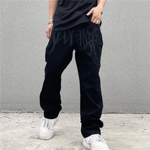 Jeans masculin de luxe de luxe en denim broderie noire streetwear streetwear basse hauteur pantalon hip hop baissé