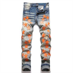 Jeans voor heren Oranje lederen patches Stretch denim jeans Street chic Gaten gescheurde taps toelopende broek Vintage noodlijdende blauwe broek T221102