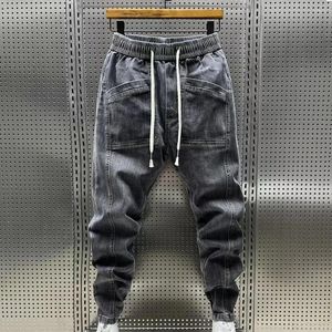 Jeans pour hommes hommes couleurs massifs élastiques cordons de taille pantalon de cargaison en jean avec des poches pantalon de harem décontracté pour le printemps