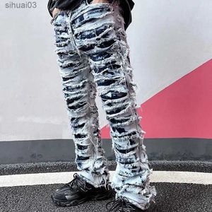 Jeans masculin mens en détresse jeans jeans vintage streetstyle empilé ajustement élégant skinny pantalon déchirant de mode décontracté de mode occasionnelle.