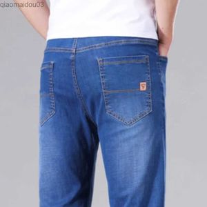 Jeans masculin pour hommes élastiques jeans denim mince printemps / été nouvelle entreprise pantalon consécutif décontracté pour hommes