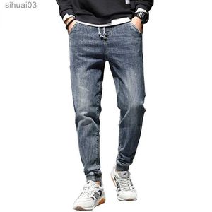 Jeans masculin en jean jean détendue pantalon harem effilé des vêtements de rue cordon de rue élastique pantalon de jogger décontracté en vrac jeansl2403 en vrac
