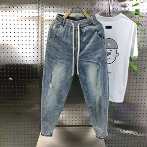 Jeans masculin Nouvel arrivée coréenne décontractée cordon de gamme de denim harem pantalon mens printemps automne mode hip hop lâche trou Baggy lavé Q240427