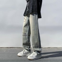 Pantaloni jeans da uomo a gamba larga con cavallo profondo strisce strappate tasche streetwear eleganti pantaloni in denim per uomini primaverili autunnali