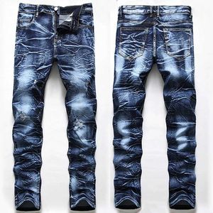 Jeans masculin jeans poli blancs jeans en denim pour hommes moustaches élastiques lavés petits pantalons hip hop quatre saisons plus taille j240507