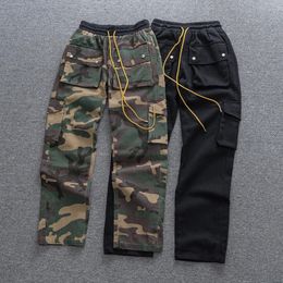 Jeans masculinos rhude calças calças cowboy preto verde camuflagem homens mulheres oversize 1 tag botão elasticidade cordão ao ar livre grosso 231117