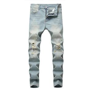 Jeans masculin style simple rétro solide trou serré jeans pantalon à la mode