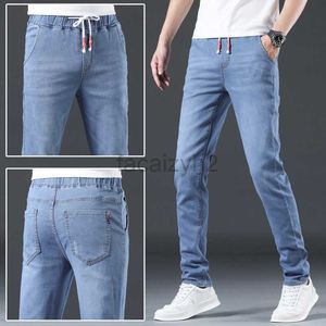 Heren jeans lente en herfst nieuwe heren jeans jeugd kleine rechte elastische licht blauwe elastische elastische heren jeans plus size broek