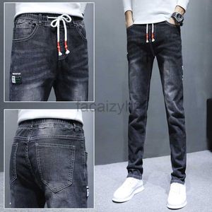 Jeans masculin Spring and Automne New Men's Jeans Edition Elastic Youth Small Straight Tube Elastic Afficage Men's Grey Jeans plus pantalon taille