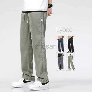 Heren jeans lente nieuwe lyocell mannen Koreaanse mode casual elastische denim broek mannelijk merk baggy rechte broek oversized 5xl d240417