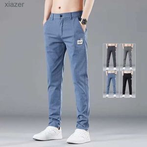 Jeans masculins printemps d'été de la taille élastique des hommes minces pantalons décontractés coréens coton de mode