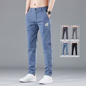 Jeans pour hommes printemps été taille élastique conception mince pantalons décontractés mode coréenne coton stretch pantalon d'affaires mâle gris bleu 230925