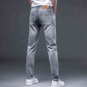 Heren jeans lente / zomer dunne slank fit kleine voeten elastische casual Koreaanse versie high-end merk mix en match een