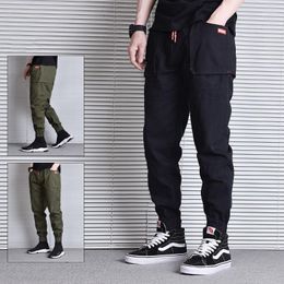 Pantalones vaqueros de los hombres Moda de la calle Hombres Loose Fit Bolsillo grande Pantalones de carga ocasionales Overoles Bordado Diseñador Hip Hop Joggers Pantalones HaremHombres Drak