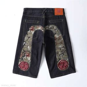 Jeans masculin été jeans jeans shorts hiphop pantalon denim cerise fleur dragon totem brodé jeans à oreilles rouges lavées à la fermeture éclair lavé 543