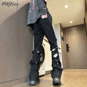 Jeans masculin y2k mens jeans noir vintage vintage multi-trou hip hop s-3xl unisex street cool street street vantaire denim pantalon américain vaqueros mode été wx