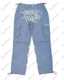 Pantalones vaqueros para hombre Y2K vintage streetwear pantalones cargo con múltiples bolsillos cintura elástica bolsillo lateral azul claro pantalones cargo de tiro bajo ropa para adolescentes 230617