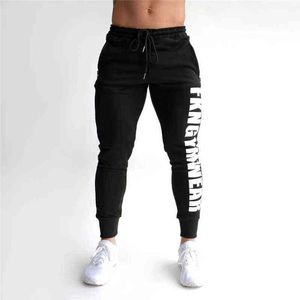 Pantalon masculin 2019 Automne Gyms Joggers Skinny Sweat Printing Collons Pantalons pour hommes Side Zipper Sheer pantalon T220909