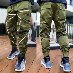 Pantalons pour hommes 2022 Automne Nouveau Pantalons décontractés Hommes Haute Strt Hip-Hop Personnalité Tendance Salopette Ample Pantalon réfléchissant T240326