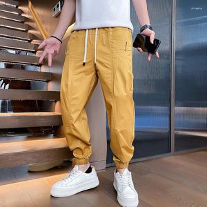 Pantalones para hombres 2023 moda de verano hombres drapeados joggers de secado rápido hombre cintura estiramiento delgado pantalones cónicos cónicos amarillos blancos verdes