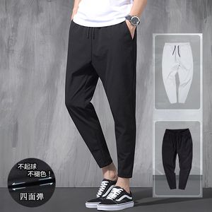 Pantalons pour hommes 2023 pantalons élastiques en soie de glace coréenne quatre saisons minces décontractés pour hommes en vrac 9 points grande taille petit pied sport printemps 230630