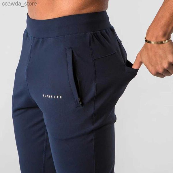 Pantalones para hombres 2023 Nuevo Muscle Fitness Running Entrenamiento Deportes Pantalones de algodón Hombres Transpirable Slim Beam Boca Casual Salud Pantalones Q240104