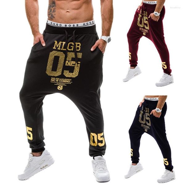 Pantalones de hombre 2023 primavera otoño Casual entrepierna baja Hip Hop viga pie pierna Streetwear Street Dance número dorado pantalones impresos hombres