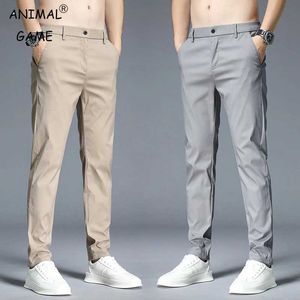 Pantalon masculin 2023 Pantalons décontractés d'été Men Thin slim ajustement élastique Cotton Business Classic Classian Colant coréen masculin kaki gris 28-38 Y240513