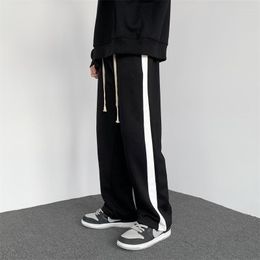 Pantaloni da uomo 2023 Moda estiva Sport Casual Versione coreana Teen Straight Loose Gamba larga Boutique