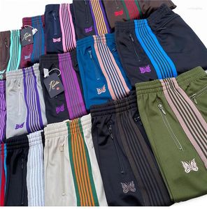 Pantalones para hombres 23SS Agujas Sweetpants Hombres Mujeres 1: 1 Cinta bordada de calidad superior Pantalones de rayas de mariposa Joggers