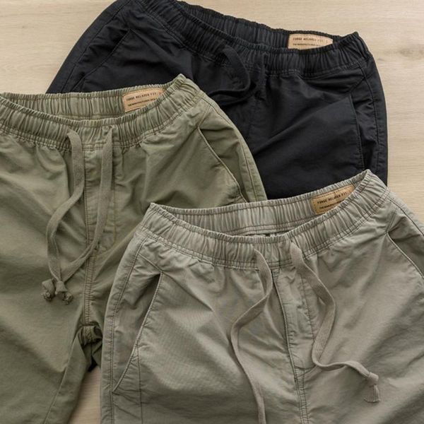 Pantalones de hombre 4 tamaños Bolsillos laterales Cintura elástica ancha Cordón Pantalones cortos deportivos Entrepierna profunda Color sólido Hombres Entrenamiento Corto Ropa masculina