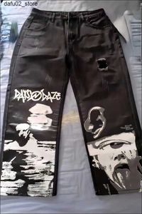 Pantalones de hombres Harajuku Americano Harajuku de patas anchas Jeans de graffiti de retrato bordeado para mujeres Jeans desgarrados de jeans y 2k jeans de cintura alta.