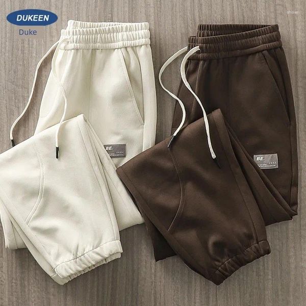 Pantalons pour hommes américains à motifs verticaux sanitaires automne air coton haute rue sports avec patchwork drapé et leggings pour
