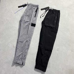 Pantalon masculin designers de marque en pierre de poche en nylon en métal brodé pantalon décontracté mince pantalon de l'île réfléchissante taille m-2xl