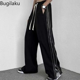 Pantalon masculin bugilaku patchwork côté zipper pantalon de jambe large pour les vêtements de rue masque