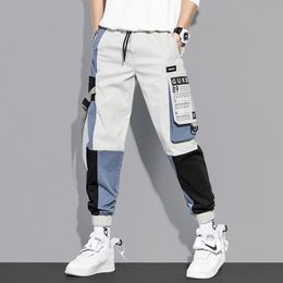 Pantaloni da uomo Casual Uomo Cargo Multi Tasca Colore misto Moda giapponese Streetwear Pantaloni da lavoro all'aperto per sport da uomo primaverili ed estiviUomini