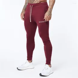 Pantalon pour hommes coton vin rouge mince pantalon de rue Vêtements de rue décontractés gymnase de fitness extérieur exercice de mode de survêtement de mode.