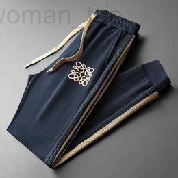 Pantalons pour hommes Designer Automne Nouveau Light Luxury Splicing Ruban Broderie Sports personnalisés et décontractés pour lâche européenne Harlan Wei Trendy Brand O5DG