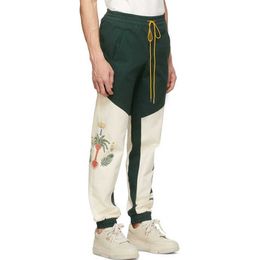 Pantalons pour hommes Vêtements de créateurs Casual Street Tendance Cocotier Paix Pigeon Splice Contraste Hip Fashion Leggings tissés