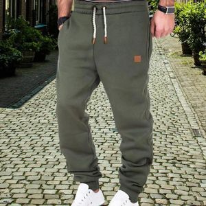 Pantalons pour hommes taille élastique pantalons de survêtement sport respirant avec cordon de serrage conception à bande de cheville pour les entraînements de gymnastique de Jogging