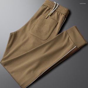 Pantalones de hombre Paquete de moda Pies Pantalones de chándal de peso pesado Tendencia de hombres Primavera y verano Estilo delgado Deportes casuales Jóvenes