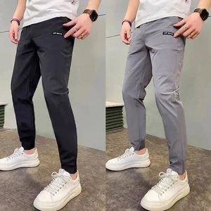 Pantalons pour hommes Mode Cordon Multi Poche Casual Impression Autographe Lâche Salopette De Sport