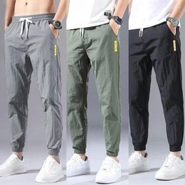 Pantalons pour hommes Fitness Casual Sports Mode Pantalon Homme Jean Hip Hop Vêtements Collants Hommes Joggers Vérifié Gym Streetwear Overol Hombre