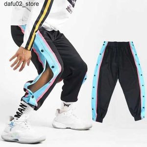 Herenbroek Harajuku Fashion Sport Heren broek Dagelijkse Outdoor Basketbal broek Holle Side Stripe Button Flight Design Creatieve broek Q240417