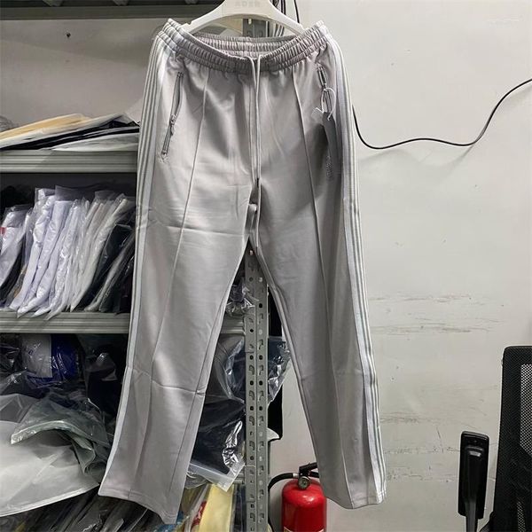 Pantalones de hombre Joggers Agujas grises Pista Hombres Mujeres Pantalones de chándal lisos de poliéster de calidad superior Pantalones de rayas de punto con logotipo de mariposa