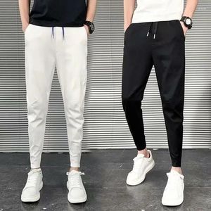 Herenbroeken Koreaanse mode slim fit casual mannen leggings zomer hoge taille zak met trekkoord effen kleur zwarte broek mannelijke kleding