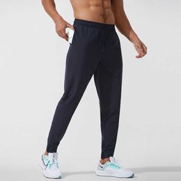 Pantalones para hombres LU Pantalones deportivos casuales Hombres Tejido Nylon Pantalones de chándal de secado rápido Pantalones de harén para correr al aire libre Paquete de entrenamiento físico Pie suelto T221205